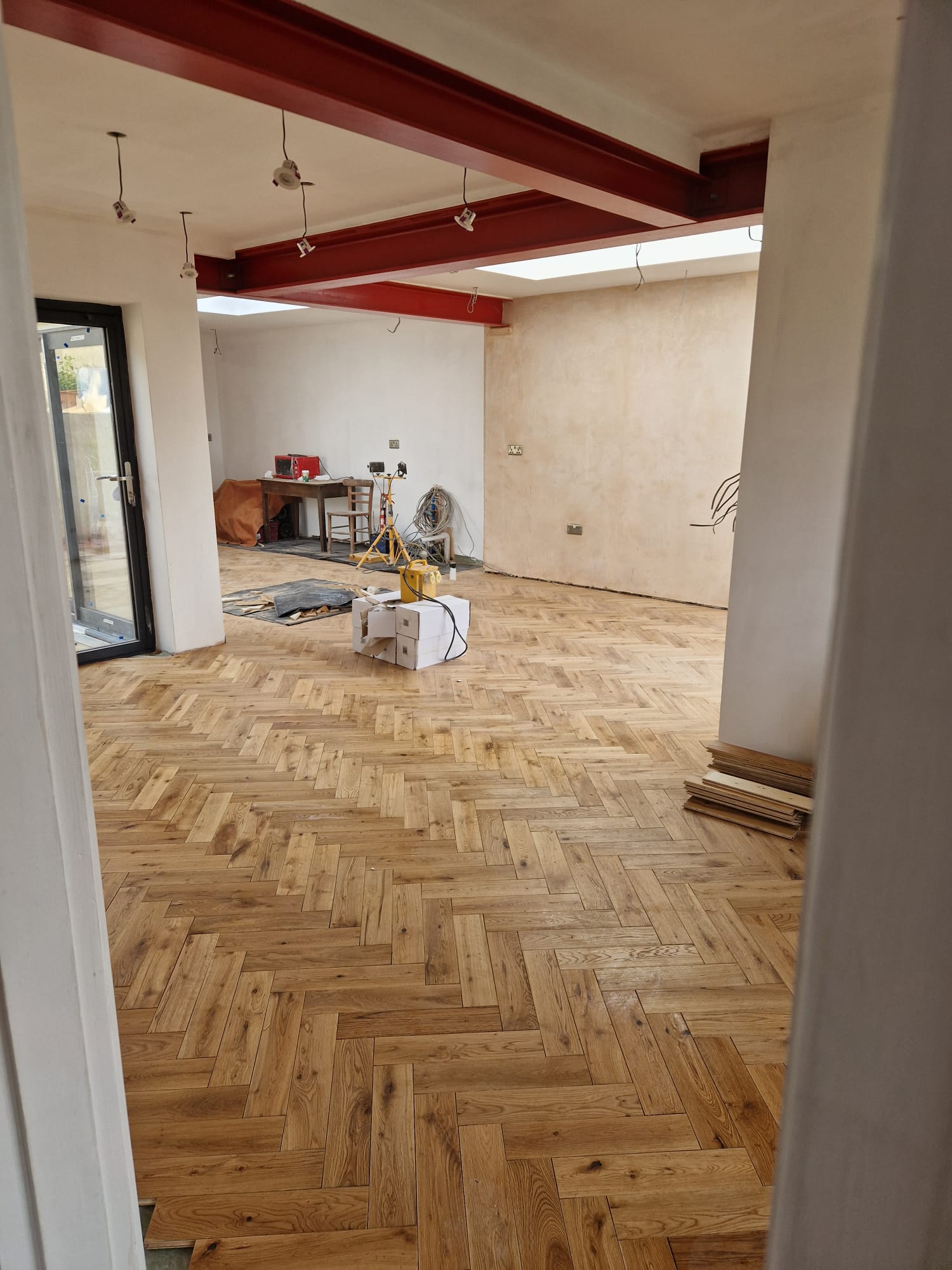 Steel beams above an open-plan room
