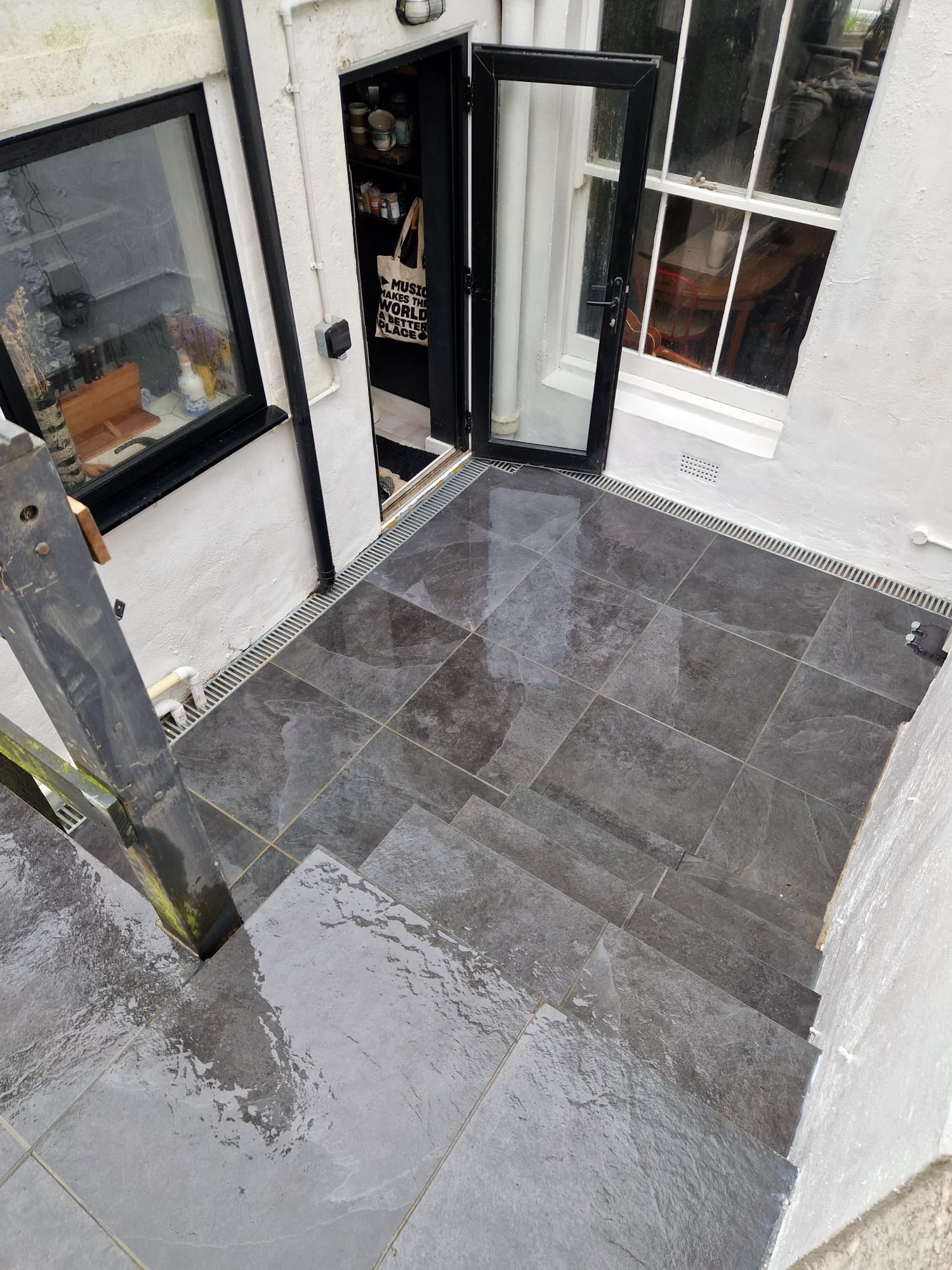 Grey-tiled rear entrance patio
