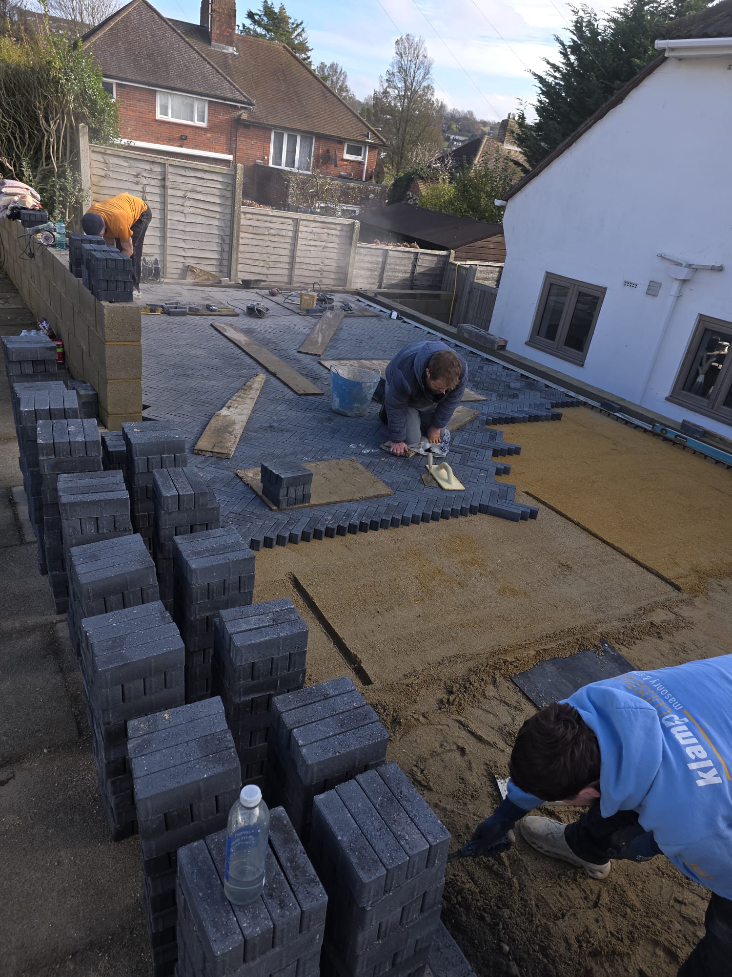 The team laying block paving & edging